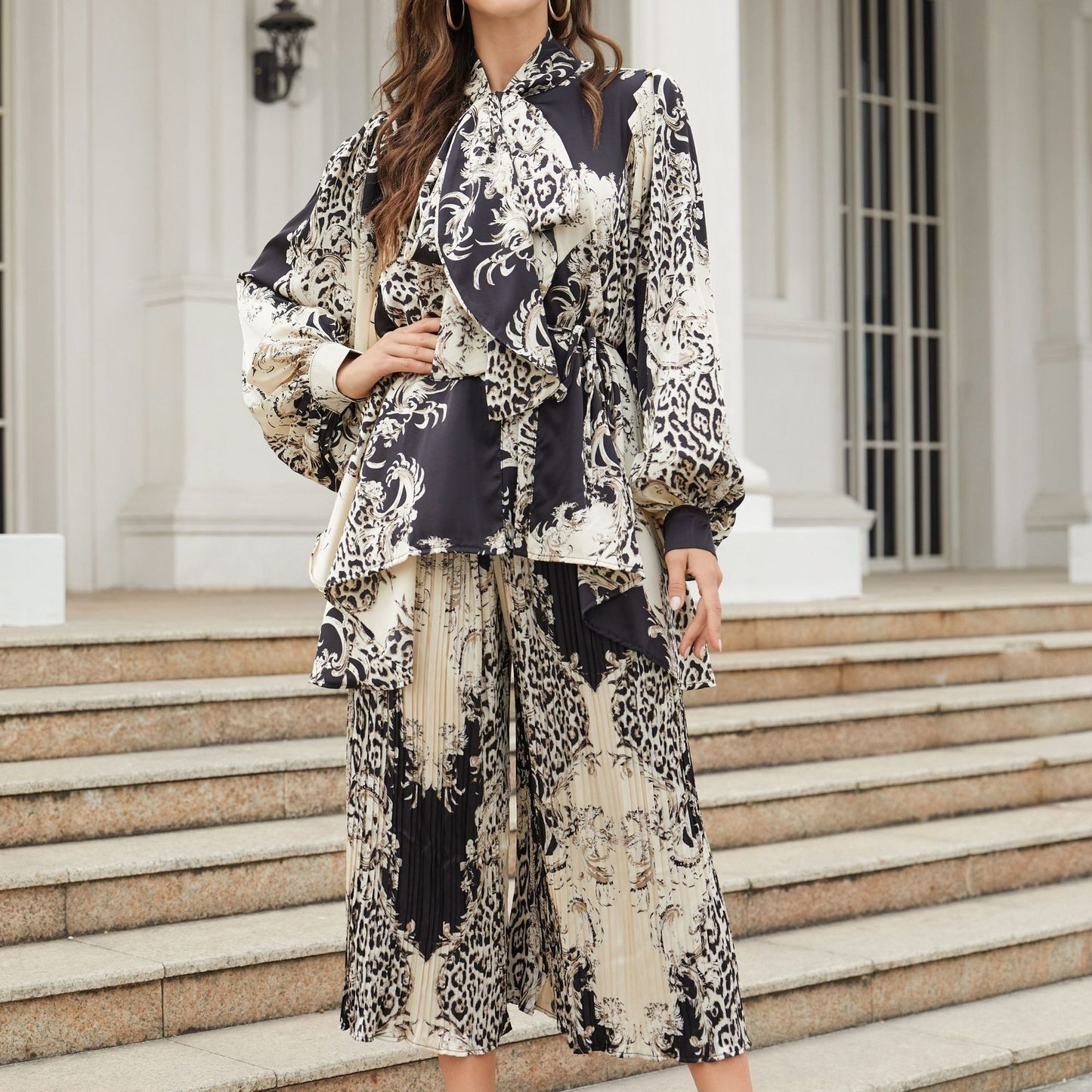 Silhouette cut lantern sleeves butterfly tie flowy belted printed trousers suit