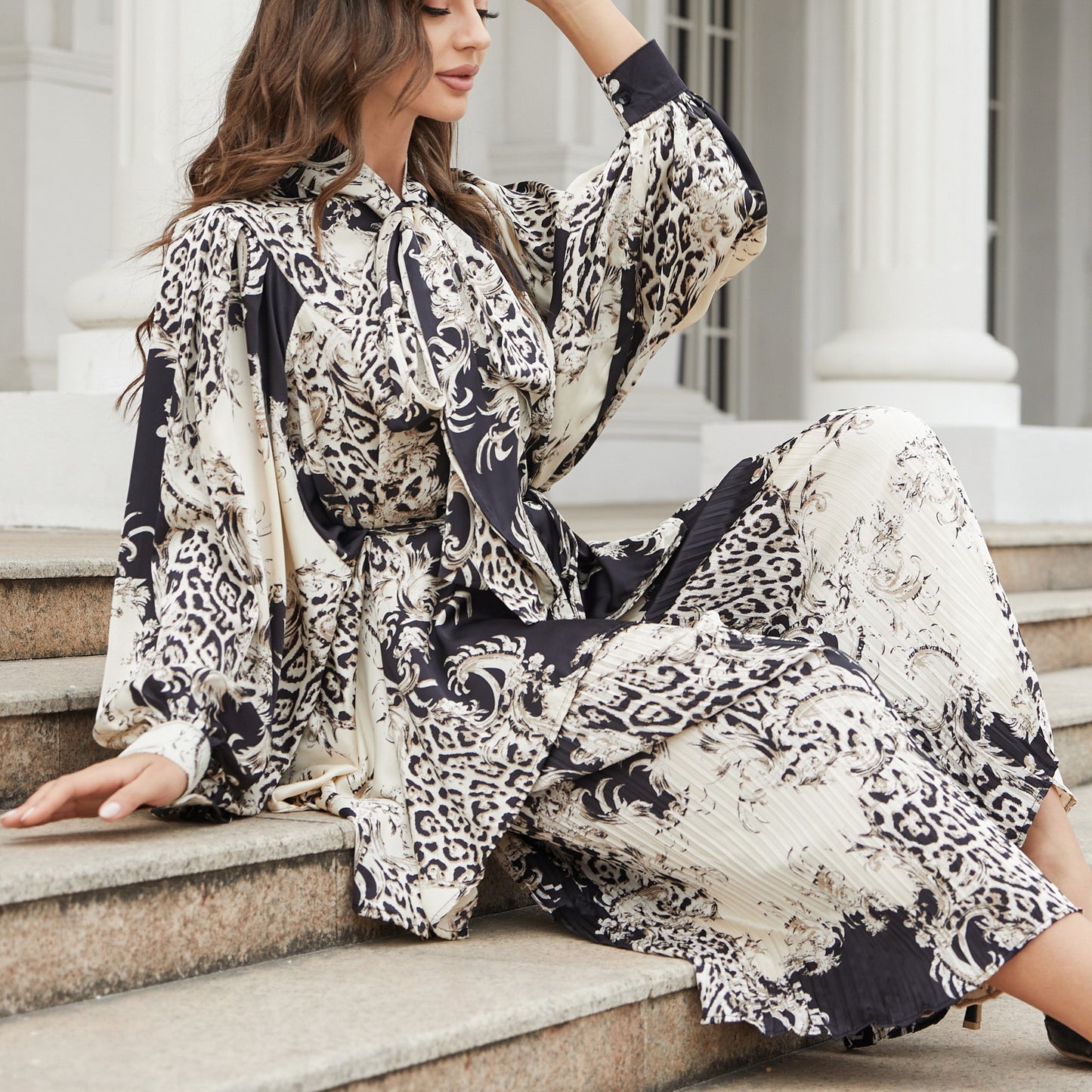 Silhouette cut lantern sleeves butterfly tie flowy belted printed trousers suit