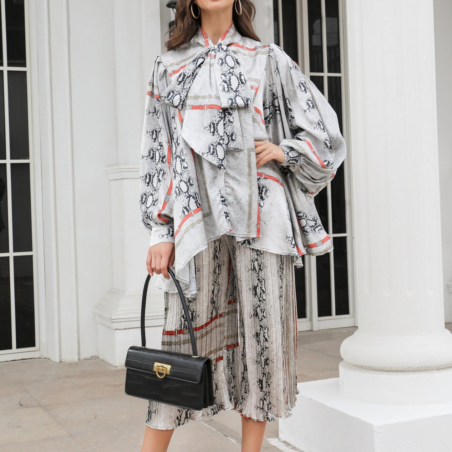 Silhouette cut lantern sleeves butterfly tie flowy belted printed trousers suit